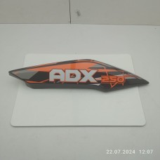 Пластик под сидением задний правый (чёрн. оранжевая наклейка) ADX250