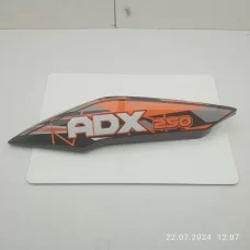 Пластик под сидением задний левый (чёрн. оранжевая наклейка) ADX250